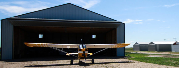 Picture of airplane outside of hangar.